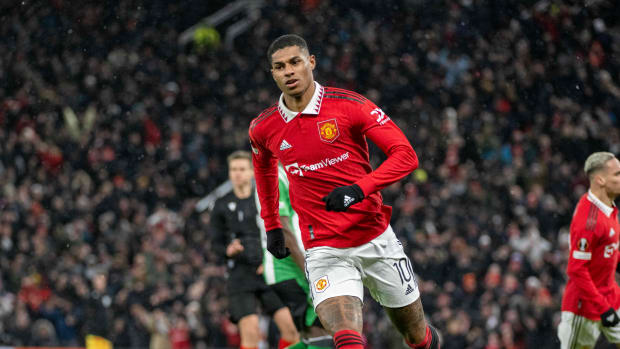 Marcus Rashford pictured celebrating after scoring for Manchester United against Real Betis in the 2022/23 UEFA Europa League round of 16 at Old Trafford